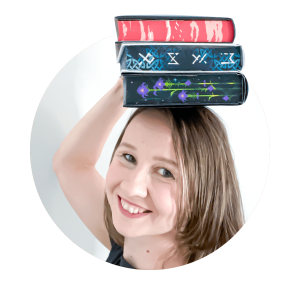 Side profile of me with a stack of stenciled edges book on top of my head