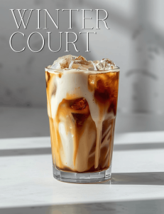 Vanilla cream cold brew with ice and cream swirl in a glass, cool minimal background, ACOTAR Winter Court inspired coffee drink